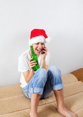 Obraz premium Young Man in Santa Hat