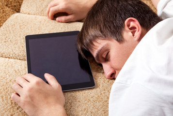 Young Man sleep with a Tablet