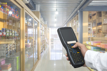 Worker checking and scanning package by tablet handheld in warehouse, Selective focus © sutthinon602