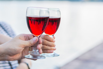 Celebrate with red wine at the river.