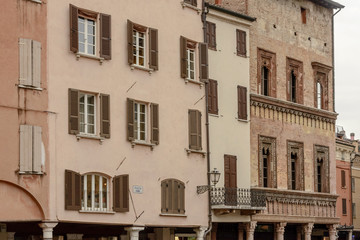 Fototapeta na wymiar facades of Renaissance buildings on Erbe square, Mantua, Italy