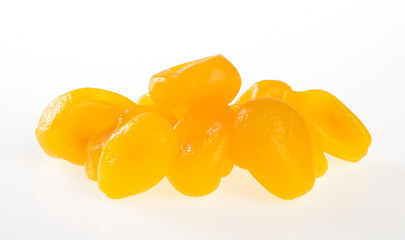 Dried preserved or preserved kumquat on background.