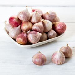 Fresh healthy garlic on white table