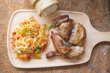 Som tum Thai with sticky rice and grilled chicken