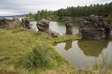 Fototapeta na wymiar Lake Myvatn, Typical Icelandic landscape, a wild nature of rocks and shrubs, rivers and lakes.