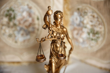 Judge, deciding on marriage divorce. Themis with wedding rings on scales. Justice concept