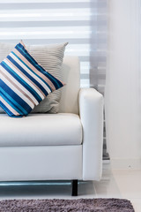 contemporary interior of Living room with part of sofa in sunny day and white curtain interior background concept