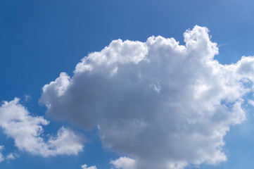 Naklejka na ściany i meble details of white clouds on blue sky, background of beautiful sky on sunny day
