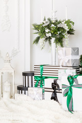 Presents under Christmas Tree in living room. Family Holiday New Year at Home