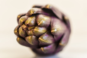 Fresh artichokes on marble table, close up, selective focus