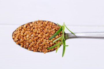 spoon of raw buckwheat