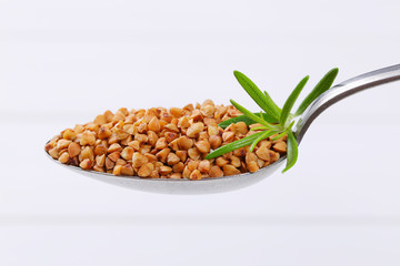 spoon of raw buckwheat
