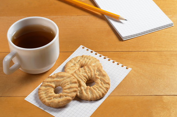 Tea, cookies and notepad