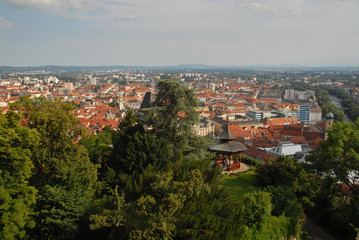 View of Graz and Schlossberg including Uhrturm and chinese pavilion from Major-Hackher-Memorial during sunset