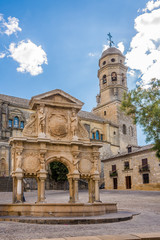 Fototapeta na wymiar View at the fountain of Santa Maria with Cathedral of Baeza - Spain