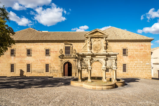 View at the fountain of Santa Maria with st.Philip seminary building in Baeza, Spain