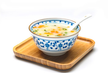 vegetable porridge in blue and white porcelain bowl