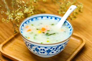 vegetable porridge in blue and white porcelain bowl