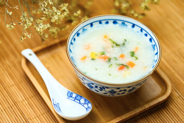 vegetable porridge in blue and white porcelain bowl