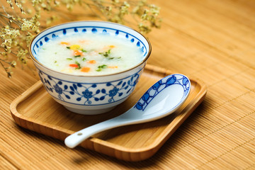 vegetable porridge in blue and white porcelain bowl