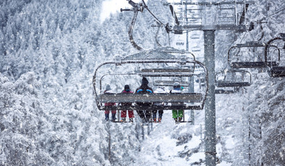 People are lifting on ski-lift -Skiing in high mountains