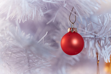 Red and Golden Christams Balls hanging on a white christmas tree - 178540520