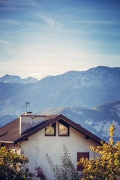 Alpine house roof against Alps