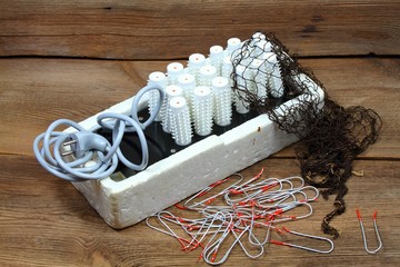 Ancient hairdresser set,  electric hair curlers, hair net. 