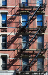 Fototapeta na wymiar Fire escape ladder on bulding façade, New York, USA