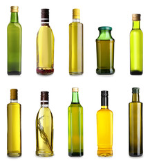 Bottles with different olive oil on white background