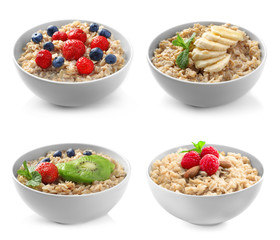 Bowls of oatmeal with berries and fruits on white background