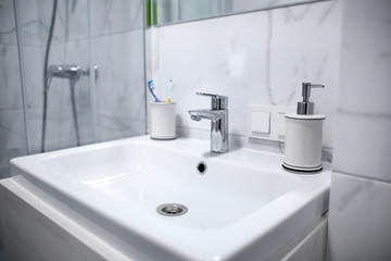 White ceramic sink in bathroom
