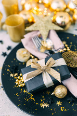 Christmas table setting in gold tones