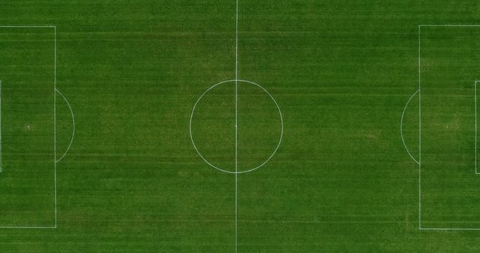 Aerial view over a green soccer field. Perfect view of a sport field (soccer/football), leisure or professionnal activity