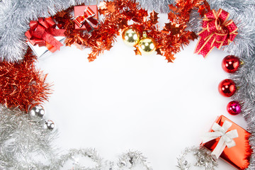 Christmas with white space on middle and beautiful of red and white tinsels decorations as frame