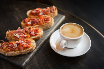 hot coffee cup with bruschetta