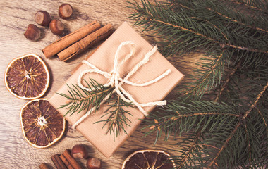 Christmas gifts in rustic boxes on wooden background.