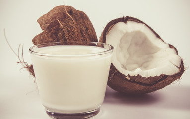Coconut with coconut milk isolated on white background.