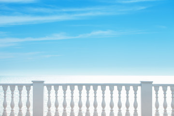 Summer view with classic white balustrade and empty terrace overlooking the sea. Summer background. Tourism