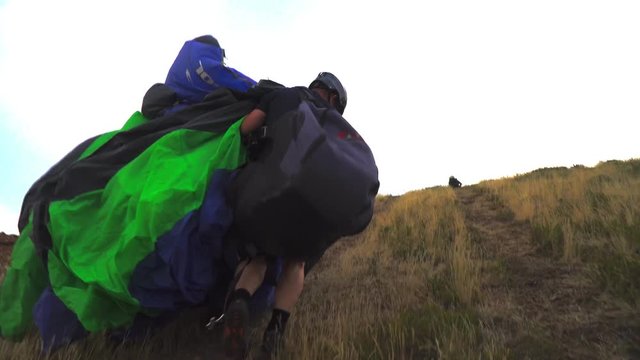 a skydiver with a folded parachute