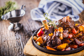 Lamb shank.Confit lamb shank with potatoes vegetable and draft beer in pub hotel or restaurant © weyo