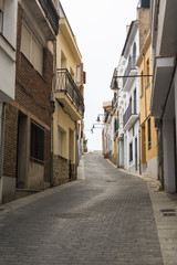 Fototapeta na wymiar A narrow street of old houses