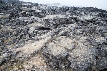 Hverarönd, Iceland. Hot vapors in a typical Icelandic landscape, a wild nature of rocks and shrubs, rivers and lakes.