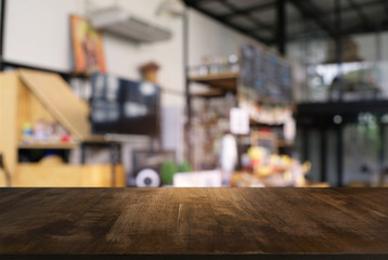 Empty dark wooden table in front of abstract blurred bokeh background of restaurant . can be used for display or montage your products.Mock up for space.