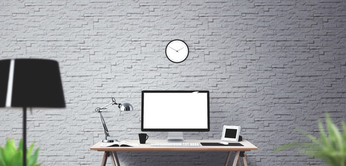 Computer display and office tools on desk.