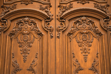 Luxuriously decorated old wooden door