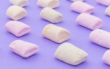 Pattern with marshmallows on violet background