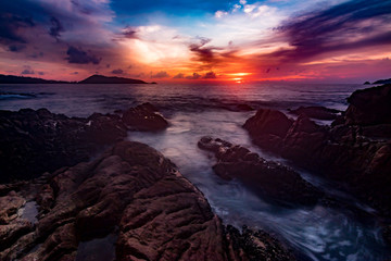 Seascape landscape nature in twilight and rock with colorful of sunset over the sun, Beach Sea, Sunset Sunlight or Sunrise, Twilight Sky Scenic with Sun Silhouette.