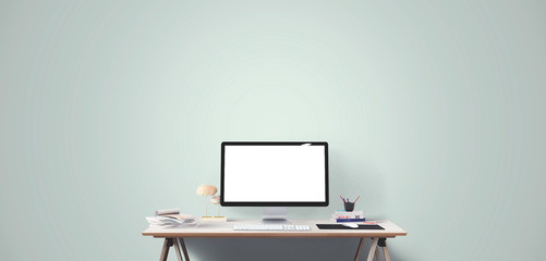 Computer display and office tools on desk. Desktop computer screen isolated. Modern creative workspace. Front view.