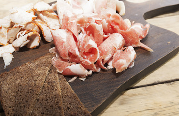 meat snacks on the kitchen table, pieces of fresh meat,